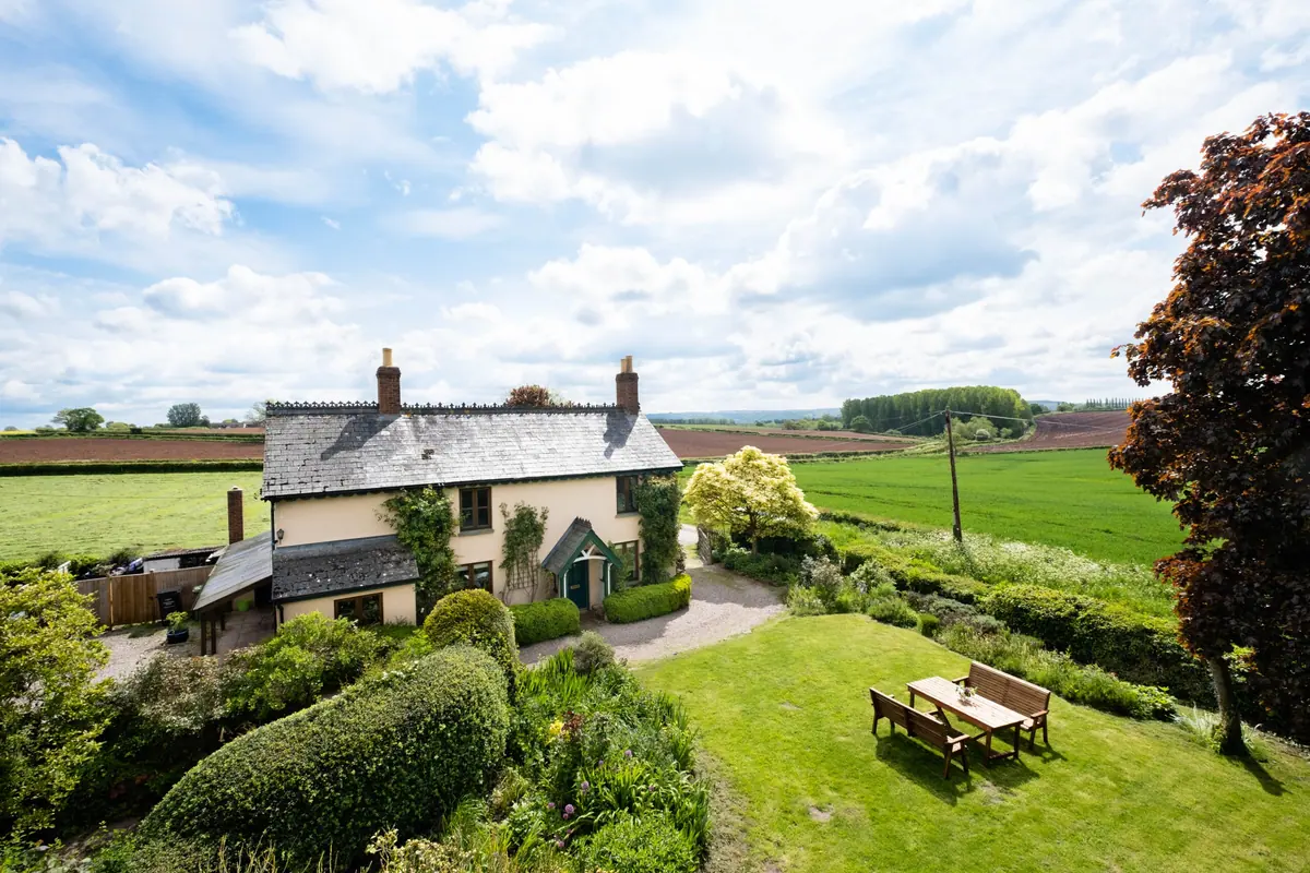 Field Cottage and its garden with open countryside beyond