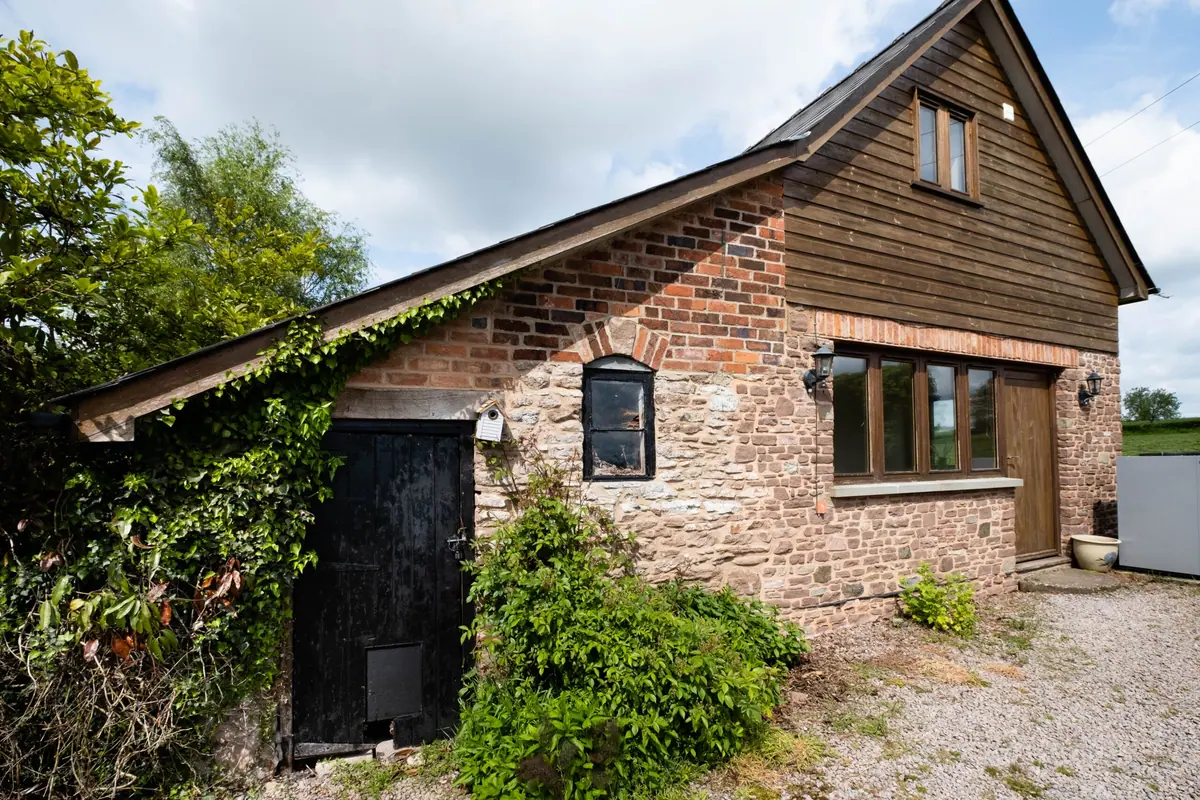 The stone and timber annexe, a short walk across the garden