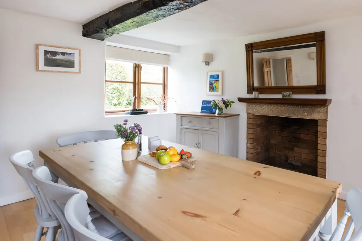The dining room from the far end, fruit bowl on the table