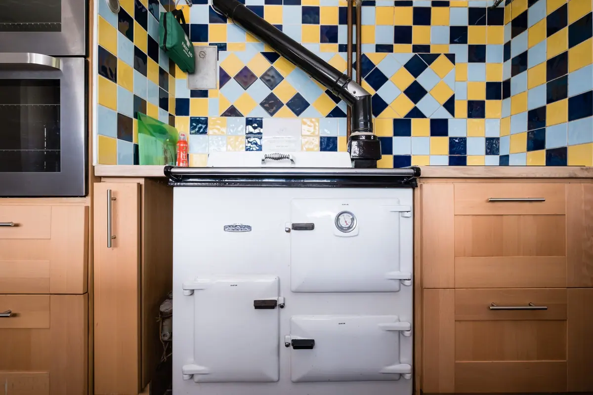The Rayburn range and its patterned tiled splashback