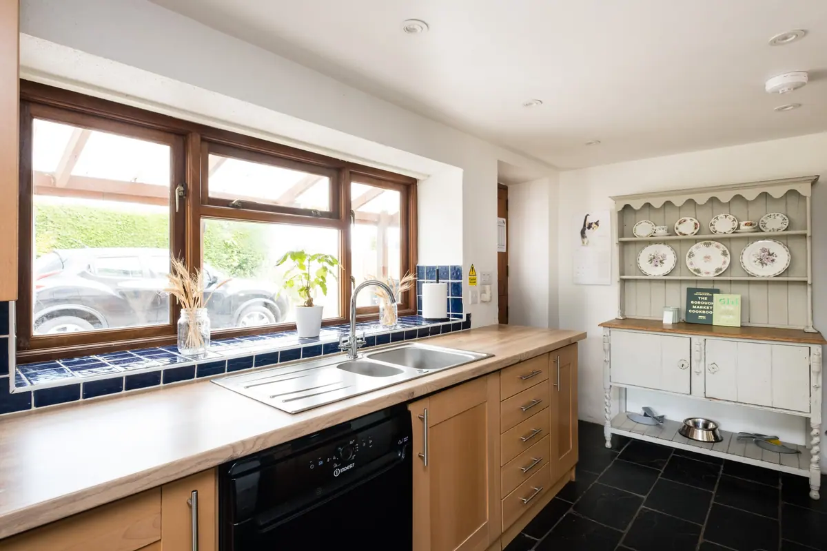 The kitchen sink under a window onto the garden