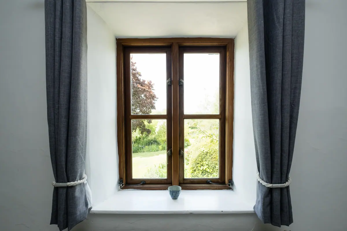 A deep window seat looking out over the garden